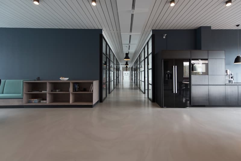 Modern office workspace with desks and collaboration areas